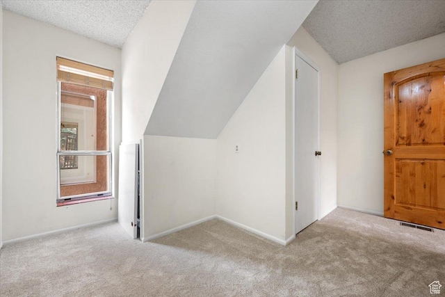 2328 W 300 N, Provo, UT 84601 - bonus room with baseboards, carpet, vaulted ceiling, and a textured ceiling