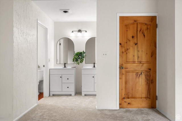 2328 W 300 N, Provo, UT 84601 - full bath featuring toilet, two vanities, baseboards, and a sink