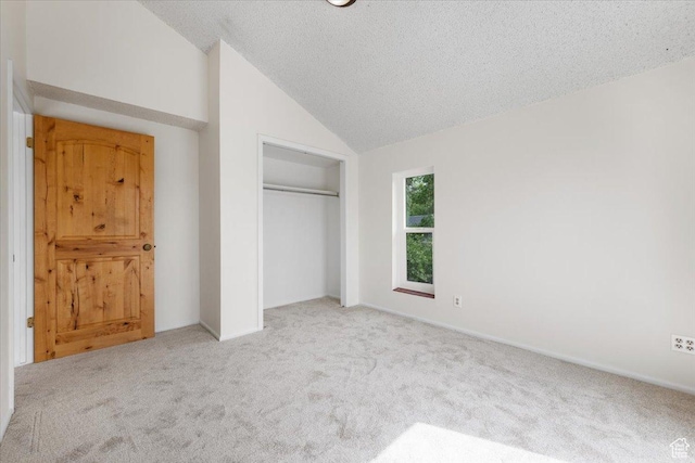 2328 W 300 N, Provo, UT 84601 - unfurnished bedroom with vaulted ceiling, carpet, a closet, and a textured ceiling