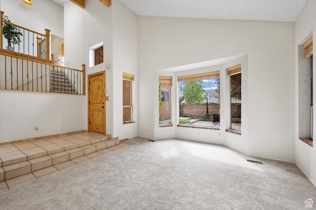 2328 W 300 N, Provo, UT 84601 - interior space with visible vents, high vaulted ceiling, stairs, and a textured ceiling