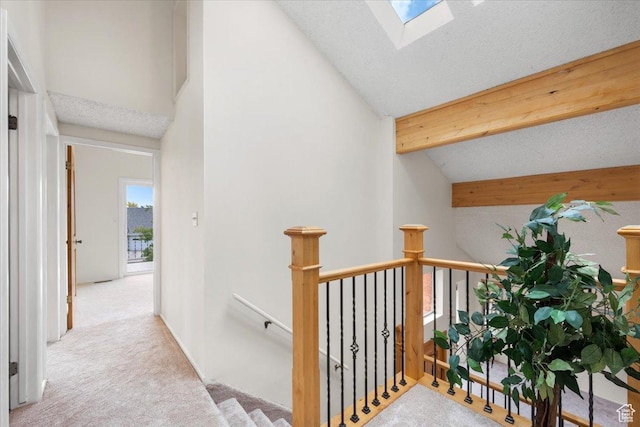 2328 W 300 N, Provo, UT 84601 - hallway with an upstairs landing, high vaulted ceiling, beam ceiling, carpet floors, and a skylight