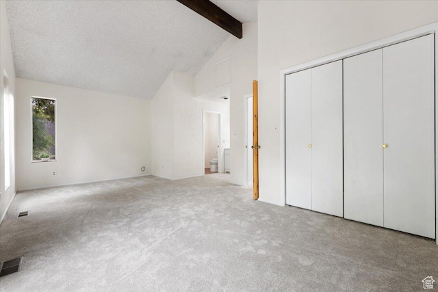 2328 W 300 N, Provo, UT 84601 - unfurnished bedroom with visible vents, beamed ceiling, high vaulted ceiling, and carpet