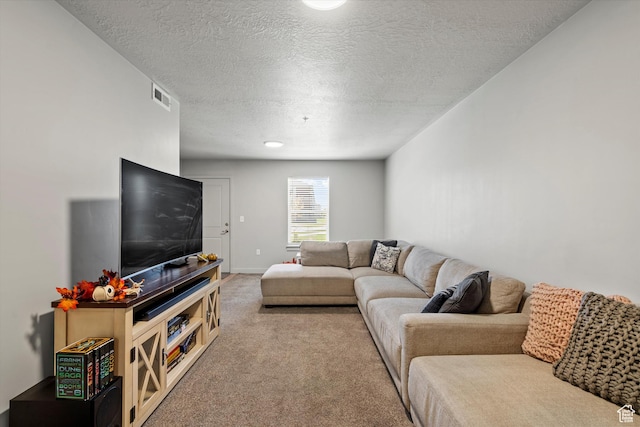 carpeted living room with a textured ceiling and visible vents