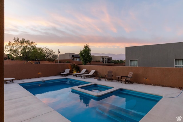 3318 S Red Rock Way, Hurricane, UT 84737 - view of swimming pool featuring fence, a pool with connected hot tub, and a patio area