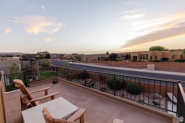 3318 S Red Rock Way, Hurricane, UT 84737 - patio terrace at dusk with a balcony