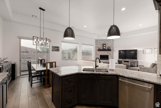 3318 S Red Rock Way, Hurricane, UT 84737 - kitchen featuring visible vents, dishwasher, a stone fireplace, a sink, and open floor plan