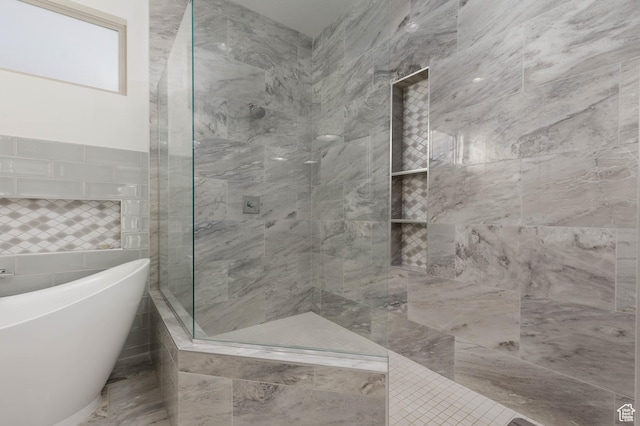 3318 S Red Rock Way, Hurricane, UT 84737 - bathroom featuring a tile shower, a freestanding bath, and tile walls