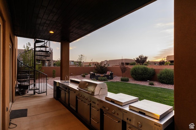 3318 S Red Rock Way, Hurricane, UT 84737 - view of patio / terrace featuring exterior kitchen, a sink, fence, and stairway