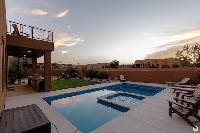 3318 S Red Rock Way, Hurricane, UT 84737 - pool at dusk with a patio, an in ground hot tub, fence, and stairs