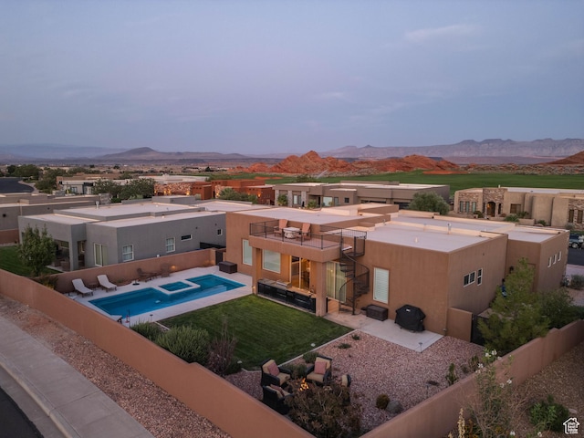 3318 S Red Rock Way, Hurricane, UT 84737 - view of pool with a patio, a mountain view, a fenced backyard, and a lawn