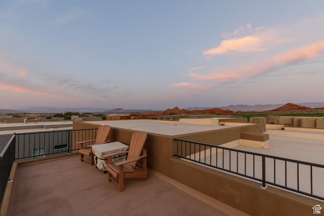 3318 S Red Rock Way, Hurricane, UT 84737 - patio terrace at dusk with a balcony and a mountain view