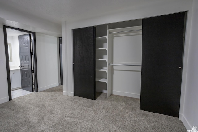 4424 W Skye Dr, South Jordan, UT 84009 - unfurnished bedroom with carpet, a closet, baseboards, and connected bathroom
