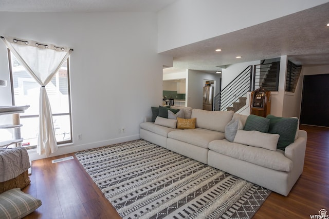 4424 W Skye Dr, South Jordan, UT 84009 - living room featuring baseboards, recessed lighting, stairway, visible vents, and wood finished floors