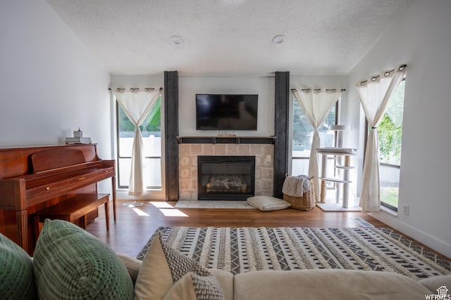 4424 W Skye Dr, South Jordan, UT 84009 - living room with a fireplace, lofted ceiling, a textured ceiling, and wood finished floors