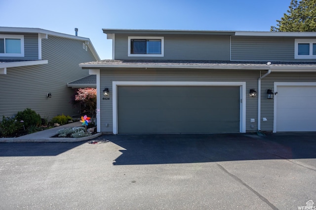 townhome / multi-family property with a garage