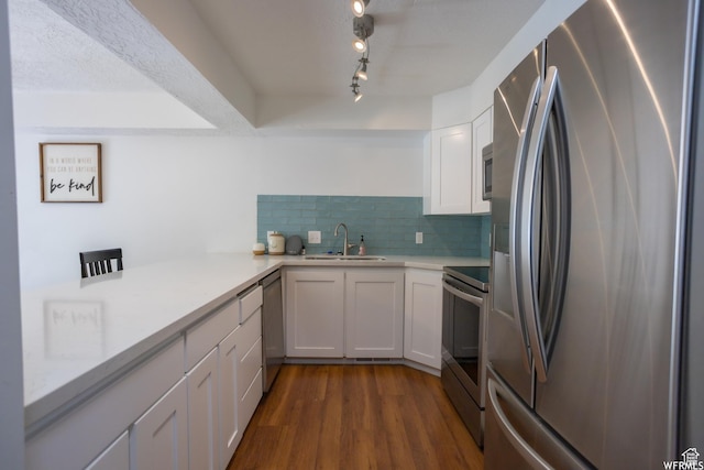 4424 W Skye Dr, South Jordan, UT 84009 - kitchen with dark wood finished floors, light countertops, a sink, stainless steel appliances, and decorative backsplash