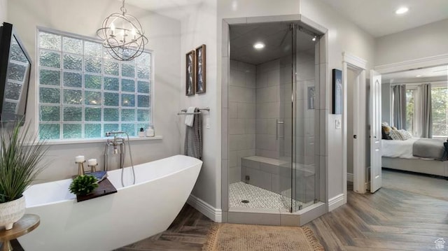 643 W Ridgewood Cir, Farmington, UT 84025 - bathroom featuring a stall shower, a chandelier, ensuite bath, a freestanding bath, and recessed lighting