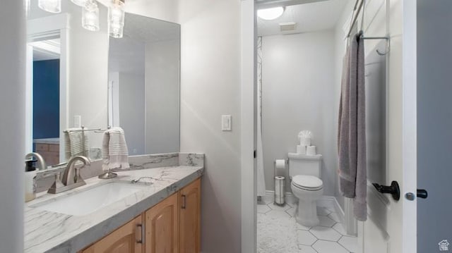 643 W Ridgewood Cir, Farmington, UT 84025 - bathroom with toilet, vanity, tile patterned flooring, baseboards, and visible vents