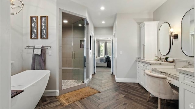 643 W Ridgewood Cir, Farmington, UT 84025 - bathroom featuring a stall shower, vanity, baseboards, a freestanding bath, and recessed lighting