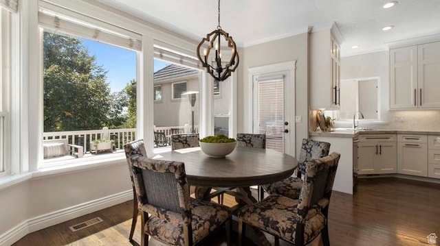 643 W Ridgewood Cir, Farmington, UT 84025 - dining area with visible vents, baseboards, ornamental molding, dark wood-style floors, and a notable chandelier