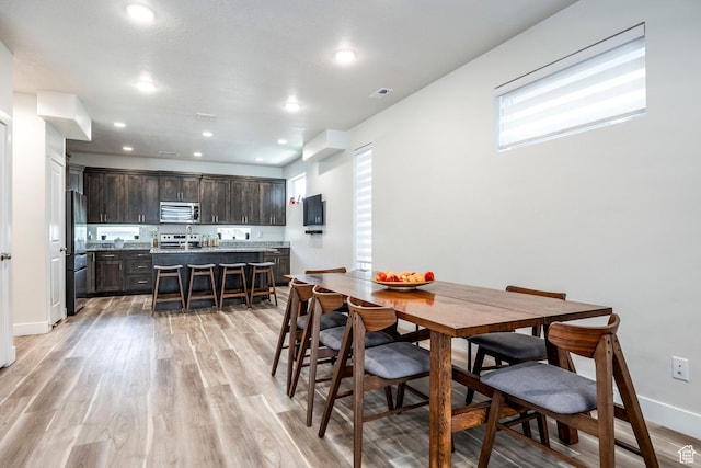 668 S 400 E, Clearfield, UT 84015 - dining area with light wood finished floors, recessed lighting, and baseboards