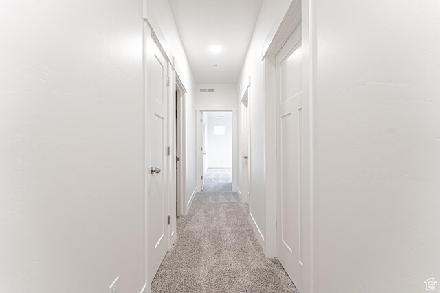 4718 W Neill Ln Unit Mm303, Riverton, UT 84096 - corridor featuring baseboards, light colored carpet, and visible vents