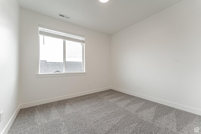 4718 W Neill Ln Unit Mm303, Riverton, UT 84096 - spare room with baseboards, carpet floors, and visible vents