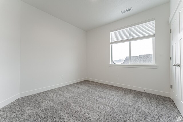 4718 W Neill Ln Unit Mm303, Riverton, UT 84096 - empty room featuring baseboards, carpet flooring, and visible vents