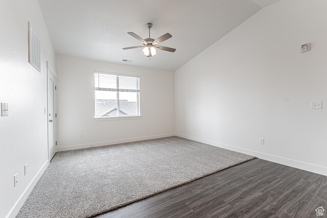 4718 W Neill Ln Unit Mm303, Riverton, UT 84096 - unfurnished room featuring vaulted ceiling, baseboards, visible vents, ceiling fan, and dark wood-type flooring
