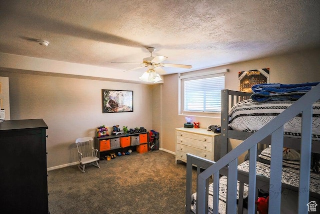bedroom with a textured ceiling, baseboards, a ceiling fan, and dark colored carpet