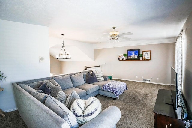 living room with baseboards, carpet, ceiling fan with notable chandelier, and visible vents