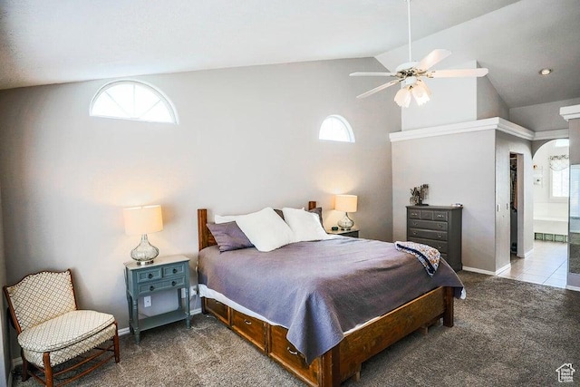 bedroom featuring carpet floors, vaulted ceiling, and multiple windows