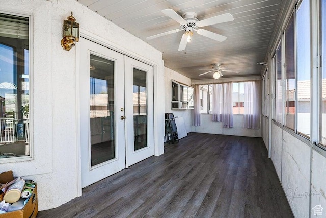 unfurnished sunroom with french doors and wood finished floors