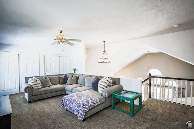living room with carpet flooring, ceiling fan, and lofted ceiling