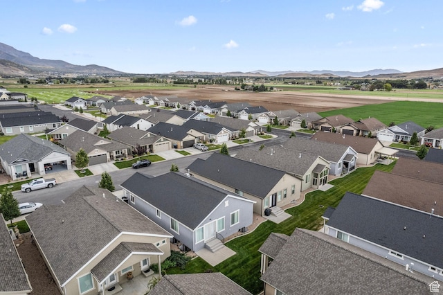 aerial view with a mountain view and a residential view