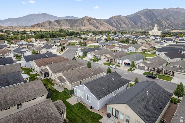 bird's eye view with a residential view and a mountain view