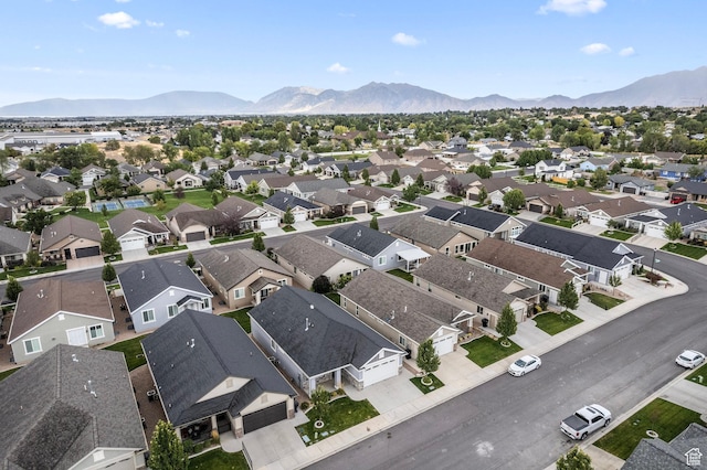 drone / aerial view featuring a residential view and a mountain view