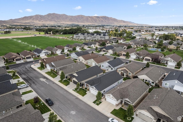birds eye view of property with a residential view and a mountain view