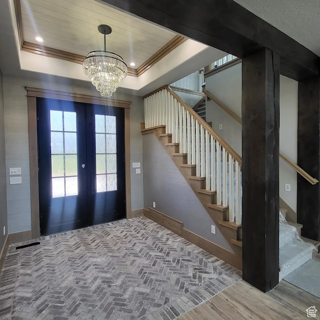 2580 E 279 S, Spanish Fork, UT 84660 - foyer featuring french doors, an inviting chandelier, a raised ceiling, and wood-type flooring