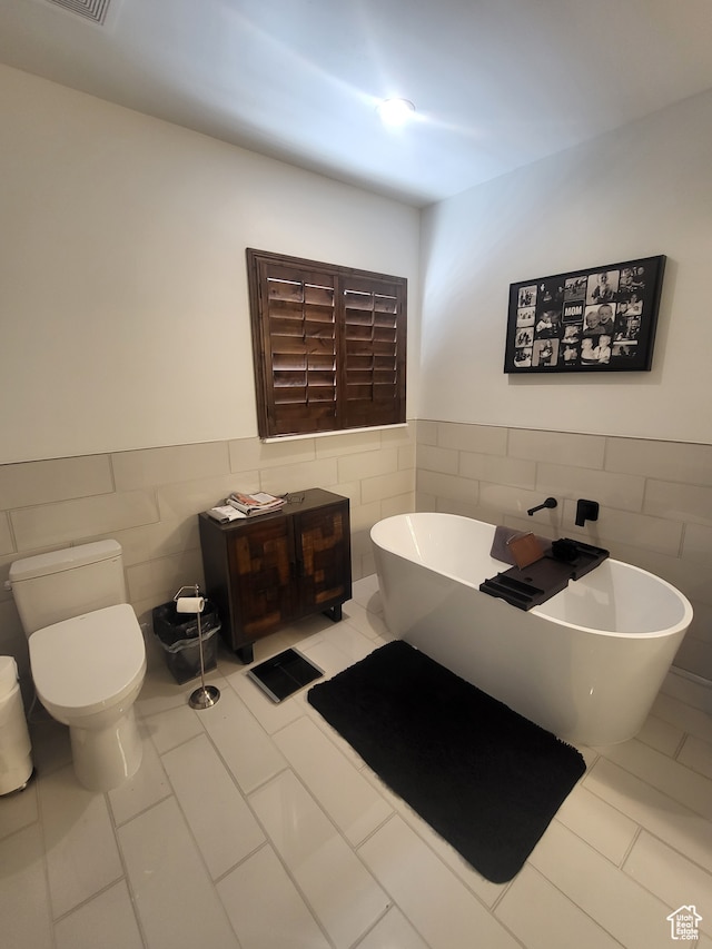 2580 E 279 S, Spanish Fork, UT 84660 - bathroom with tile walls, tile patterned flooring, a bath, and toilet