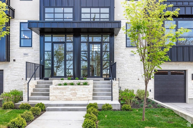 656 N E Capitol St, Salt Lake City, UT 84103 - property entrance with stone siding, a balcony, and driveway