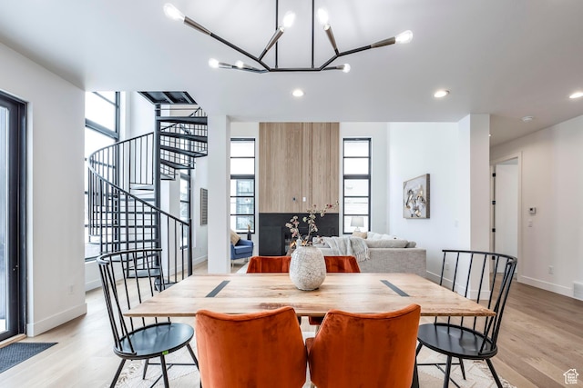 656 N E Capitol St, Salt Lake City, UT 84103 - dining room with light wood-style floors, stairway, healthy amount of natural light, and recessed lighting