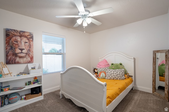 bedroom featuring ceiling fan and carpet flooring