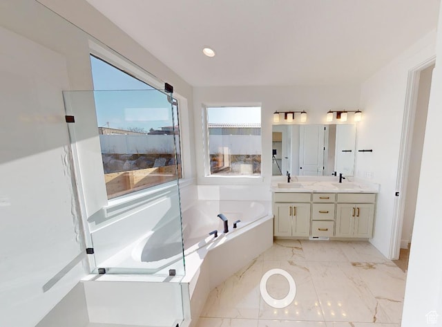 full bathroom featuring double vanity, recessed lighting, a bath, marble finish floor, and a shower