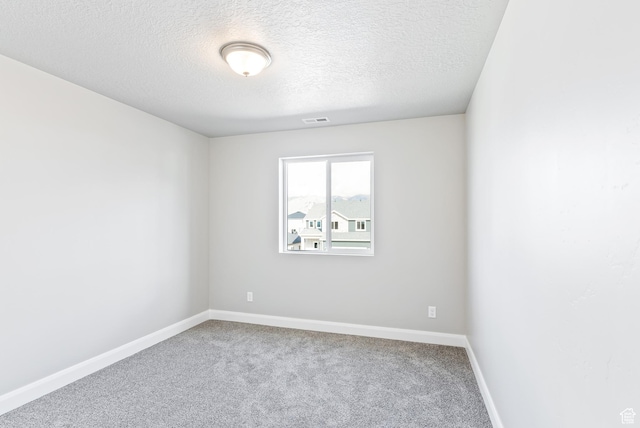 1749 S Sageberry Dr Unit 350, Santaquin, UT 84655 - spare room featuring carpet flooring, a textured ceiling, and baseboards
