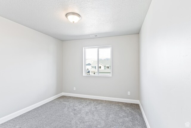 1749 S Sageberry Dr Unit 350, Santaquin, UT 84655 - spare room featuring carpet flooring, a textured ceiling, and baseboards