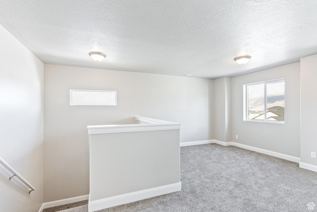 1749 S Sageberry Dr Unit 350, Santaquin, UT 84655 - carpeted spare room with plenty of natural light, a textured ceiling, and baseboards