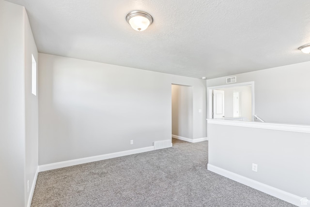 1749 S Sageberry Dr Unit 350, Santaquin, UT 84655 - carpeted spare room featuring baseboards and a textured ceiling