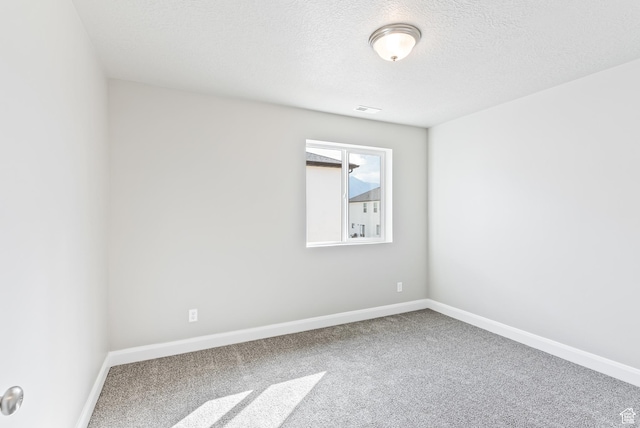 1749 S Sageberry Dr Unit 350, Santaquin, UT 84655 - carpeted spare room with baseboards and a textured ceiling