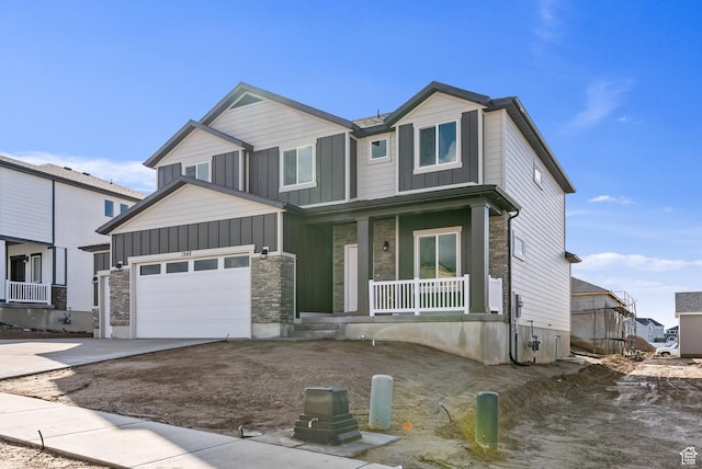 1749 S Sageberry Dr Unit 350, Santaquin, UT 84655 - view of front facade with a porch, driveway, a garage, and board and batten siding